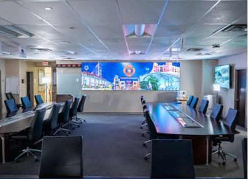 Executive briefing room with a large LED video wall